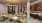 a room with a chandelier and couches