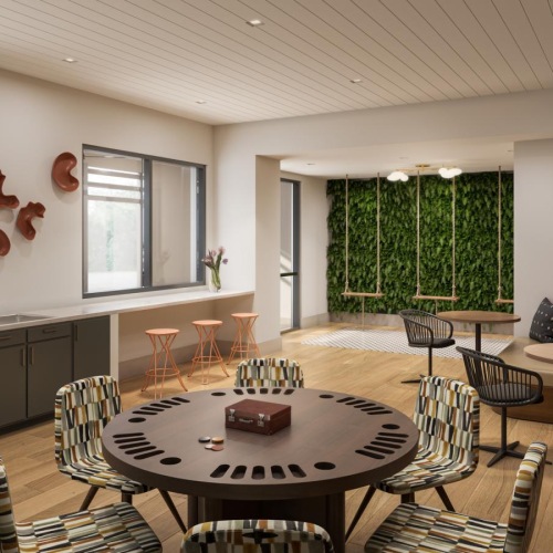 a lounge area with a dining table