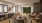 a lounge area with a dining table