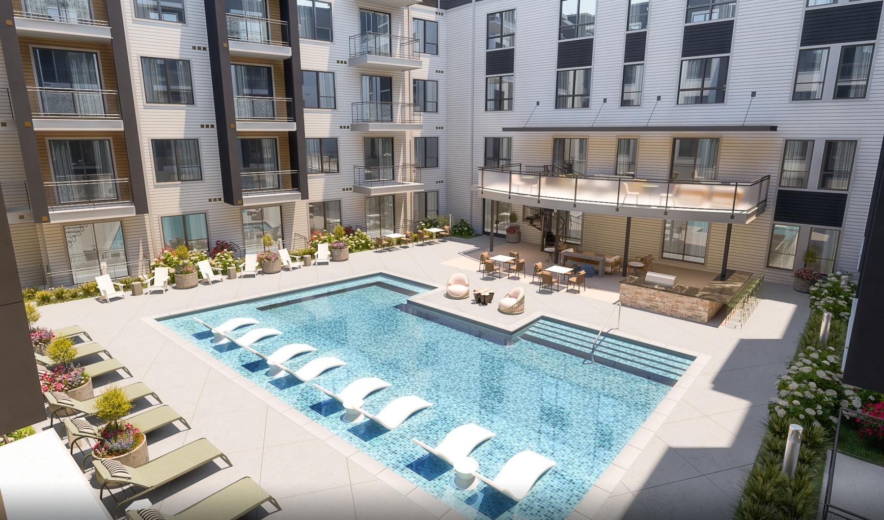 a swimming pool in a courtyard between buildings