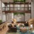 a room with chairs and plants