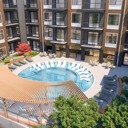 a swimming pool in a courtyard between buildings