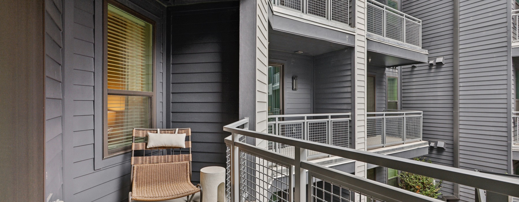 an apartment balcony with seating